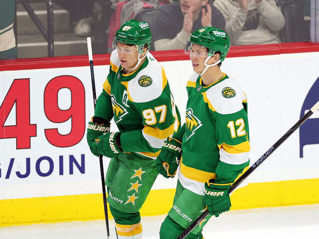 ST PAUL, MINNESOTA - APRIL 02: Kirill Kaprizov #97 and Matt Boldy #12 of the Minnesota Wild celebrate an empty-net goal against the Vancouver Canucks in the third period at Grand Casino Arena on April 02, 2026 in St Paul, Minnesota. The Wild defeated the Canucks 5-2.
