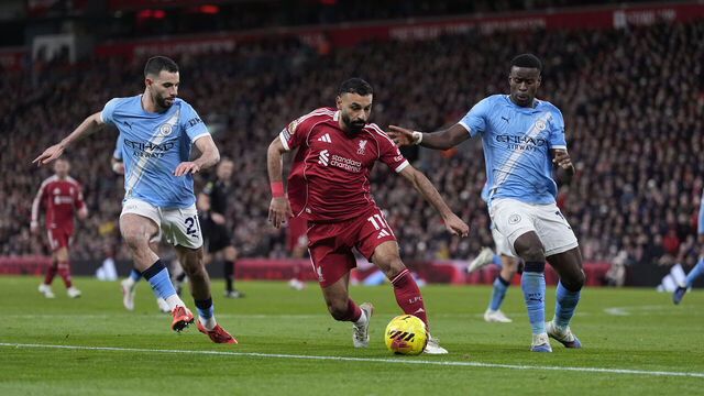 Liverpool's Mohamed Salah (centre) and Manchester City's Rayan Ait-Nouri and Marc Guehi (right) battle for the ball during the Premier League match at Anfield, Liverpool. Picture date: Sunday February 8, 2026.