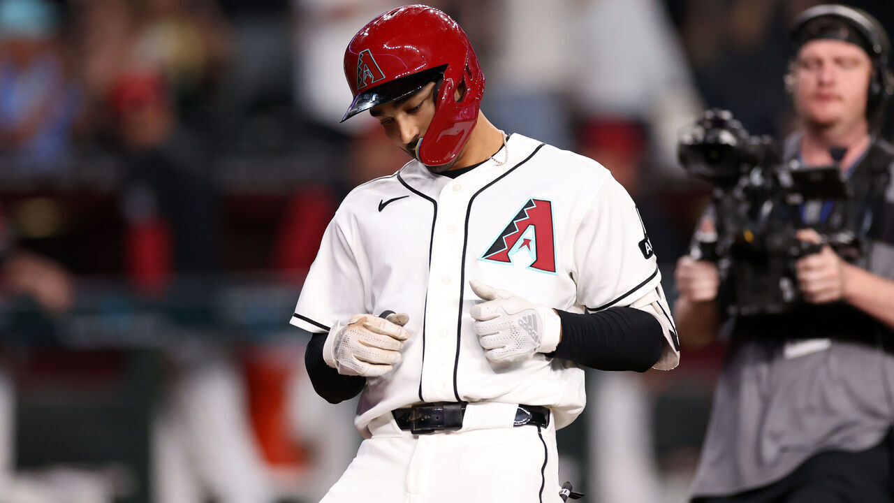 PHOENIX, ARIZONA - APRIL 02: Jordan Lawlar #10 of the Arizona Diamondbacks crosses home plate after hitting a solo home run against the Atlanta Braves in the third inning at Chase Field on April 02, 2026 in Phoenix, Arizona. The Braves defeated the Diamondbacks 17-2.