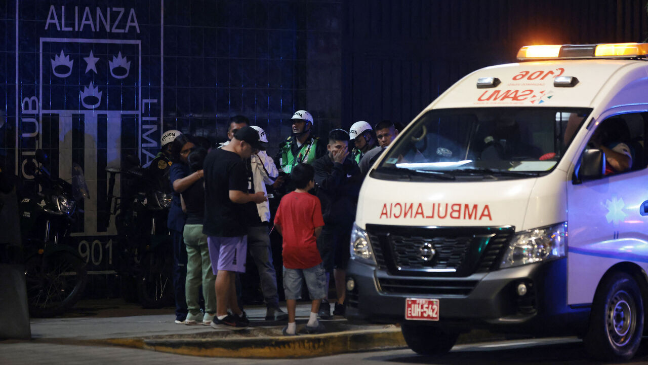 Relatives wait for news at the entrance of the Alejandro Villanueva Stadium after an accident in the stands where Alianza Lima's fans were cheering for their team on the eve of the match against Universitario in Lima on April 3, 2026. At least one person was killed and 47 others were injured, including three minors, in "an incident" that occurred Friday at Alianza Lima's stadium in Peru during a flag-waving rally in support of the team ahead of the Peruvian football derby, the Ministry of Health reported.