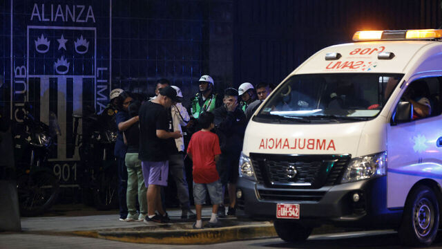 Relatives wait for news at the entrance of the Alejandro Villanueva Stadium after an accident in the stands where Alianza Lima's fans were cheering for their team on the eve of the match against Universitario in Lima on April 3, 2026. At least one person was killed and 47 others were injured, including three minors, in "an incident" that occurred Friday at Alianza Lima's stadium in Peru during a flag-waving rally in support of the team ahead of the Peruvian football derby, the Ministry of Health reported.