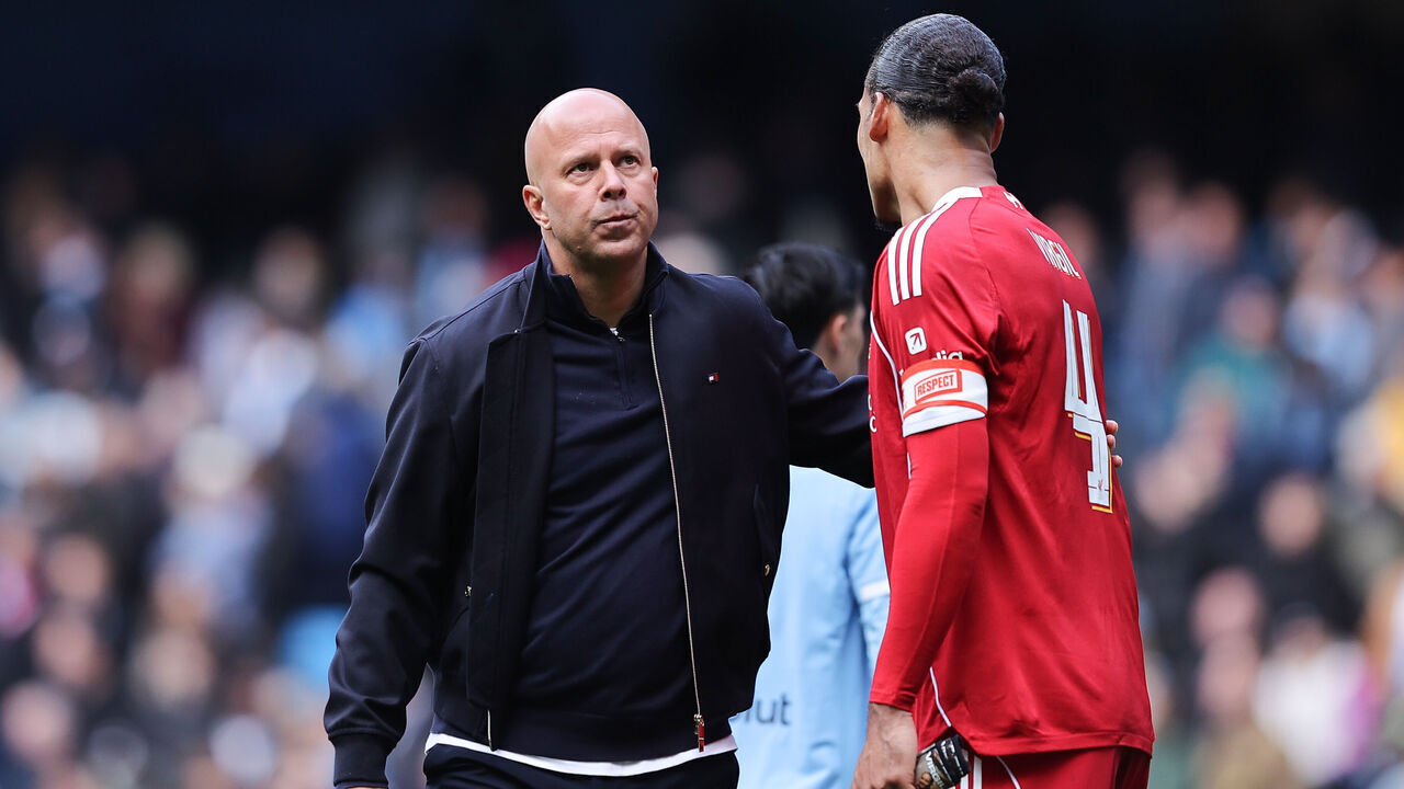 MANCHESTER, ENGLAND - APRIL 04: Arne Slot, head coach of Liverpool, acknowledges Virgil van Dijk of Liverpool after the Emirates FA Cup Quarter Final match between Manchester City and Liverpool on April 04, 2026 in Manchester, England.