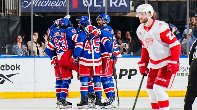 NEW YORK, NEW YORK - APRIL 4: Gabe Perreault #94 of the New York Rangers celebrates with teammates after scoring a goal during the second period against the Detroit Red Wings at Madison Square Garden on April 4, 2026 in New York City.