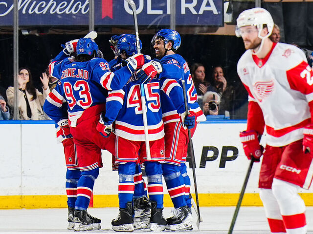 NEW YORK, NEW YORK - APRIL 4: Gabe Perreault #94 of the New York Rangers celebrates with teammates after scoring a goal during the second period against the Detroit Red Wings at Madison Square Garden on April 4, 2026 in New York City.
