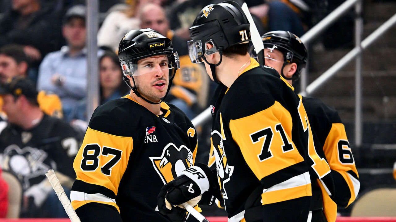 PITTSBURGH, PA - MARCH 31: Sidney Crosby #87 and Evgeni Malkin #71 of the Pittsburgh Penguins talk against the Detroit Red Wings at PPG PAINTS Arena on March 31, 2026 in Pittsburgh, Pennsylvania.