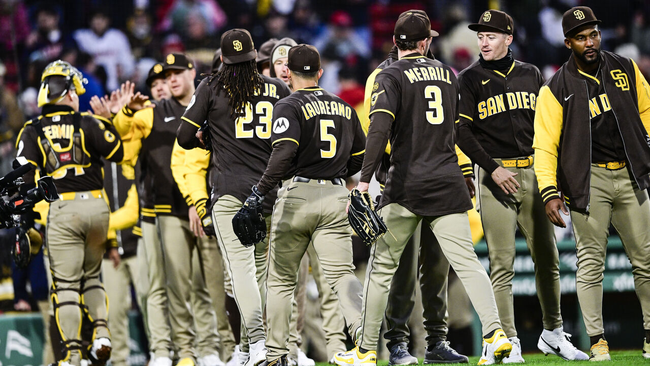 BOSTON, MASSACHUSETTS - APRIL 04: Members of the San Diego Padres celebrate their ninth inning win over the Boston Red Sox at Fenway Park on April 04, 2026 in Boston, Massachusetts.