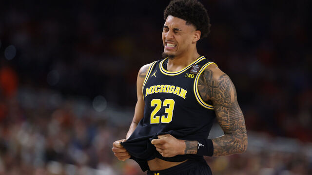 INDIANAPOLIS, INDIANA - APRIL 04: Yaxel Lendeborg #23 of the Michigan Wolverines reacts during the first half of the game against the Arizona Wildcats in the Final Four of the 2026 NCAA Men's Basketball Tournament at Lucas Oil Stadium on April 04, 2026 in Indianapolis, Indiana.