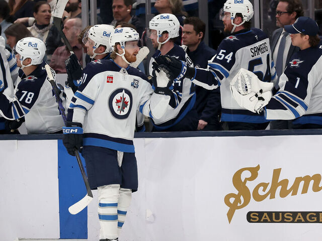 COLUMBUS, OHIO - APRIL 4: Kyle Connor #81 of the Winnipeg Jets is congratulated by his teammates after scoring a goal during the third period of the game against the Columbus Blue Jackets at Nationwide Arena on April 4, 2026 in Columbus, Ohio. Winnipeg defeated Columbus 2-1.