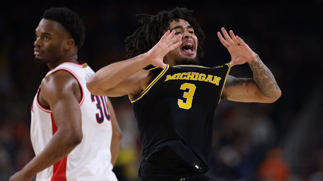 INDIANAPOLIS, INDIANA - APRIL 04: Elliot Cadeau #3 of the Michigan Wolverines reacts against the Arizona Wildcats during the second half in the Final Four of the 2026 NCAA Men's Basketball Tournament at Lucas Oil Stadium on April 04, 2026 in Indianapolis, Indiana.
