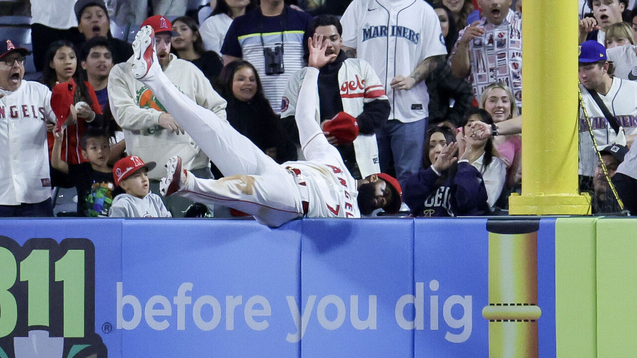 ANAHEIM, CALIFORNIA - APRIL 04: Jo Adell #7 of the Los Angeles Angels catches a fly out in foul territory by J.P. Crawford #3 of the Seattle Mariners during the ninth inning of a baseball game at Angel Stadium of Anaheim on April 04, 2026 in Anaheim, California.