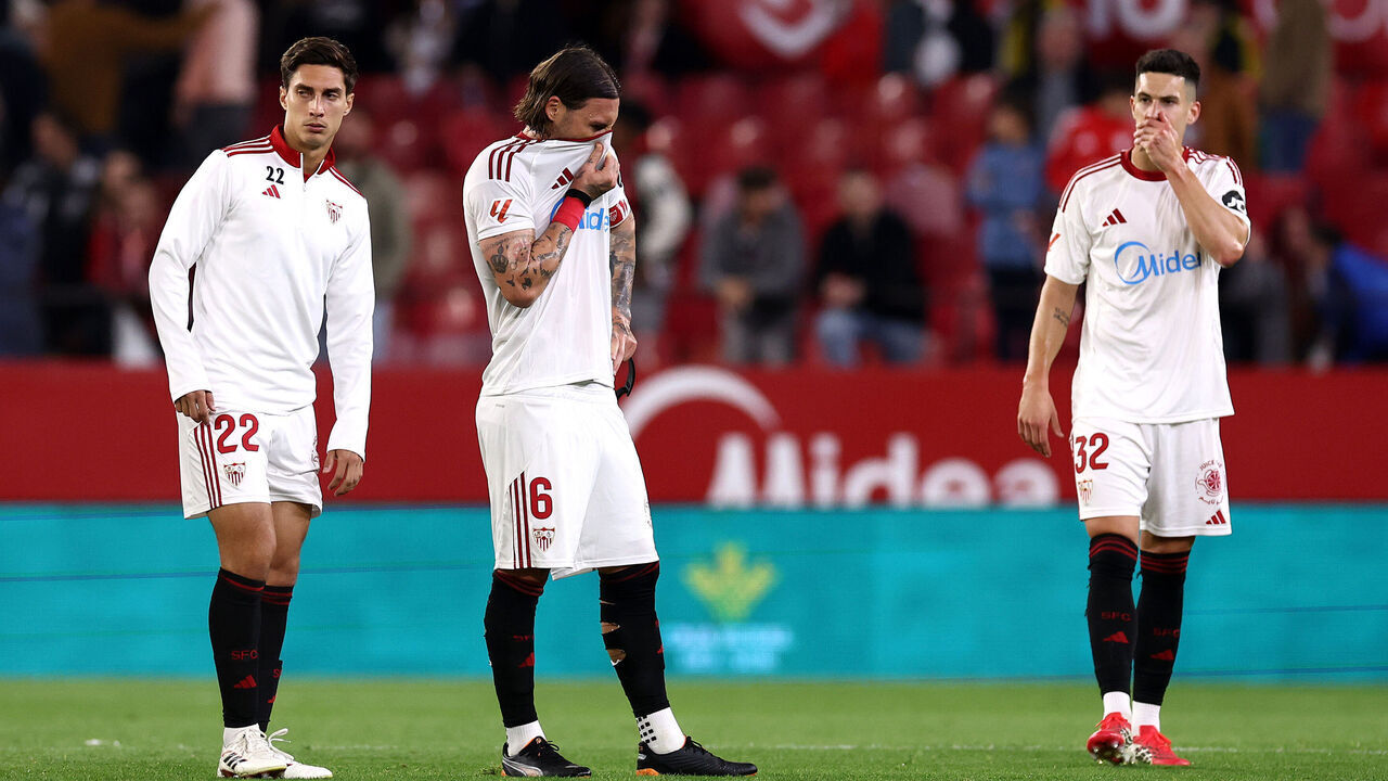 SEVILLE, SPAIN - MARCH 21: Federico Gattoni, Nemanja Gudelj and Andres Castrin of Sevilla FC react after the team's defeat in the LaLiga EA Sports match between Sevilla FC and Valencia CF at Estadio Ramon Sanchez Pizjuan on March 21, 2026 in Seville, Spain.