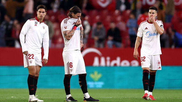 SEVILLE, SPAIN - MARCH 21: Federico Gattoni, Nemanja Gudelj and Andres Castrin of Sevilla FC react after the team's defeat in the LaLiga EA Sports match between Sevilla FC and Valencia CF at Estadio Ramon Sanchez Pizjuan on March 21, 2026 in Seville, Spain.