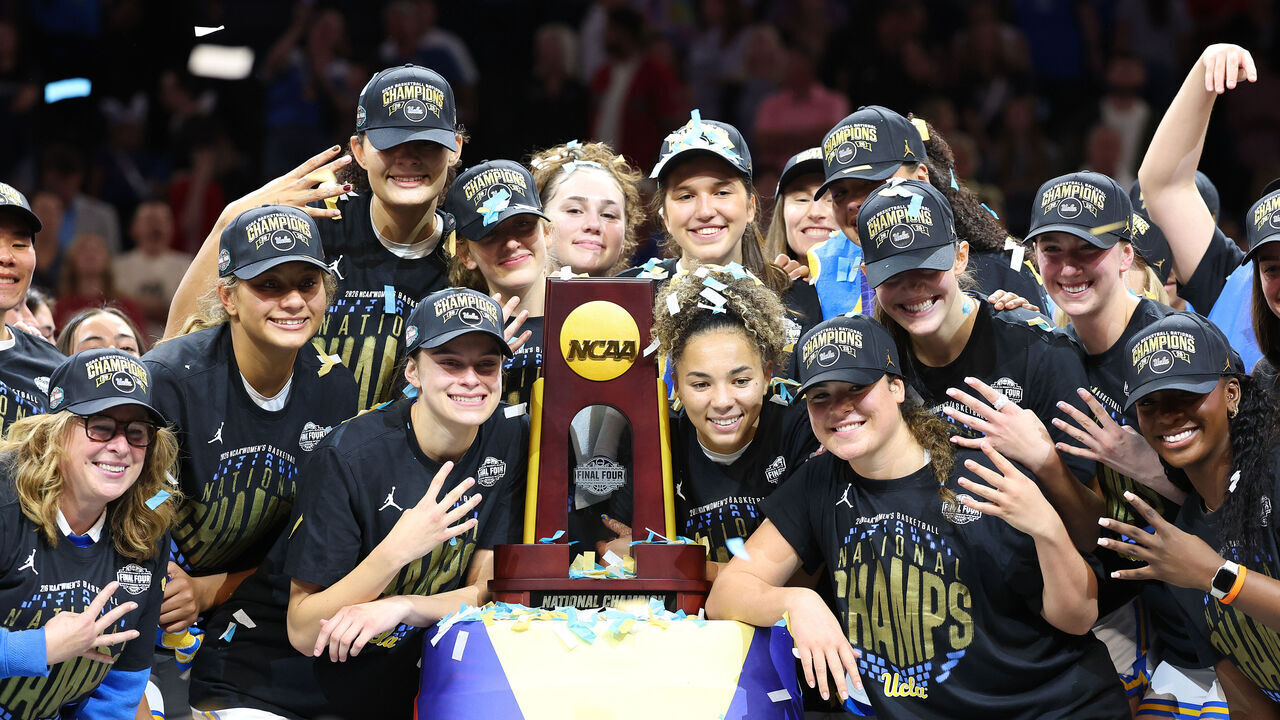PHOENIX, ARIZONA - APRIL 05: Members of the UCLA Bruins pose with the trophy after their victory against the South Carolina Gamecocks in the National Championship of the NCAA Women's Basketball Tournament at Mortgage Matchup Center on April 05, 2026 in Phoenix, Arizona.