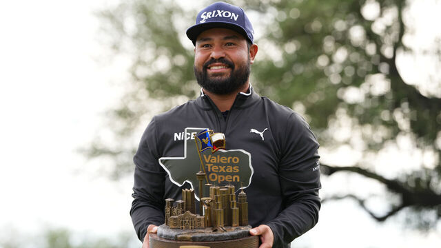 SAN ANTONIO, TEXAS - APRIL 05: J.J. Spaun of the United States poses with the trophy on the 18th green after winning the final round of the Valero Texas Open 2026 at TPC San Antonio on April 05, 2026 in San Antonio, Texas.