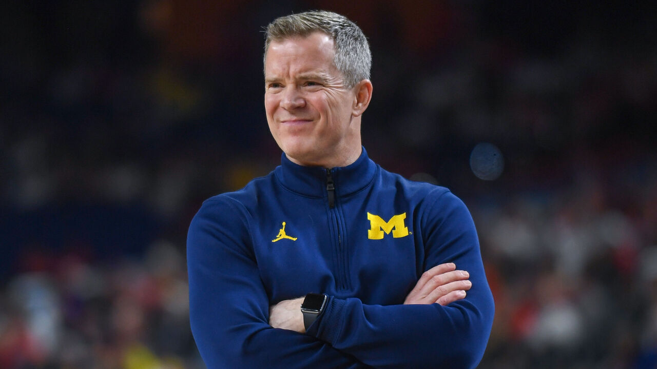 INDIANAPOLIS, INDIANA - APRIL 04: Head Basketball Coach Dusty May of the Michigan Wolverines reacts during the second half of a NCAA Men's Basketball Tournament Final Four game against the Arizona Wildcats at Lucas Oil Stadium on April 04, 2026 in Indianapolis, Indiana. The Michigan Wolverines won the game 91-73.