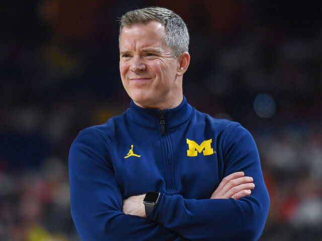 INDIANAPOLIS, INDIANA - APRIL 04: Head Basketball Coach Dusty May of the Michigan Wolverines reacts during the second half of a NCAA Men's Basketball Tournament Final Four game against the Arizona Wildcats at Lucas Oil Stadium on April 04, 2026 in Indianapolis, Indiana. The Michigan Wolverines won the game 91-73.