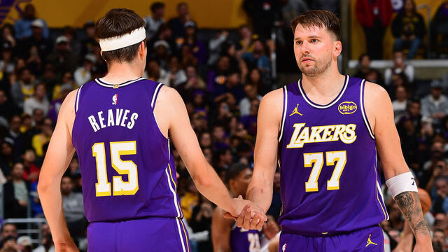 LOS ANGELES, CA - NOVEMBER 28: Austin Reaves #15 and Luka Doncic #77 of the Los Angeles Lakers high five during the game against the Dallas Mavericks during a 2025-26 Emirates NBA Cup on November 28, 2025 at Crypto.Com Arena in Los Angeles, California. NOTE TO USER: User expressly acknowledges and agrees that, by downloading and/or using this Photograph, user is consenting to the terms and conditions of the Getty Images License Agreement. Mandatory Copyright Notice: Copyright 2025 NBAE