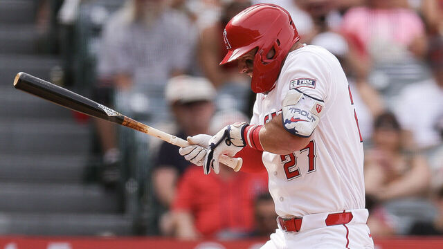 ANAHEIM, CALIFORNIA - APRIL 05: Mike Trout #27 of the Los Angeles Angels is hit by a pitch during the eighth inning of a baseball game against the Seattle Mariners at Angel Stadium of Anaheim on April 05, 2026 in Anaheim, California.