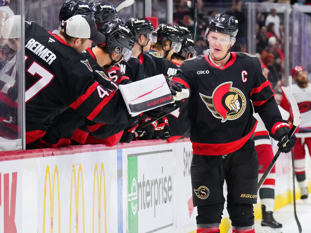 OTTAWA, CANADA - APRIL 05: Brady Tkachuk #7 of the Ottawa Senators celebrates his third period goal against the Carolina Hurricanes with his teammates at Canadian Tire Centre on April 05, 2026 in Ottawa, Ontario, Canada.