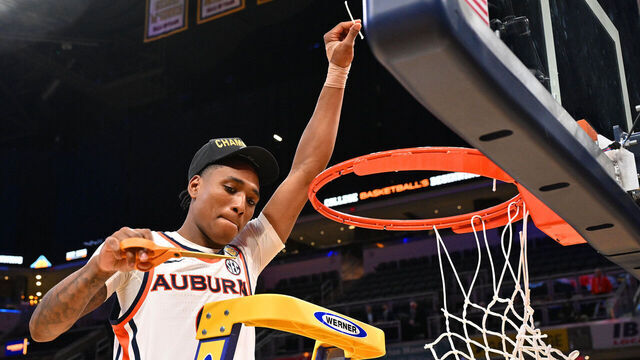 INDIANAPOLIS, INDIANA APRIL 5: Tahaad Pettiford #0 of the Auburn Tigers cuts down a piece of the net after defeating the Tulsa Golden Hurricane in the National Invitation Tournament championship game at Gainbridge Fieldhouse on April 5, 2026 in Indianapolis, Indiana.