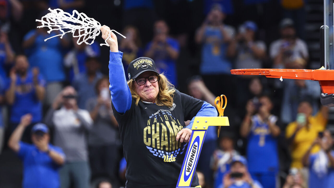 PHOENIX, ARIZONA - APRIL 5: Head coach Cori Close of the UCLA Bruins cuts the net after defeating the South Carolina Gamecocks to win the NCAA Women's Basketball Championship game at Mortgage Matchup Center on April 5, 2026 in Phoenix, Arizona.