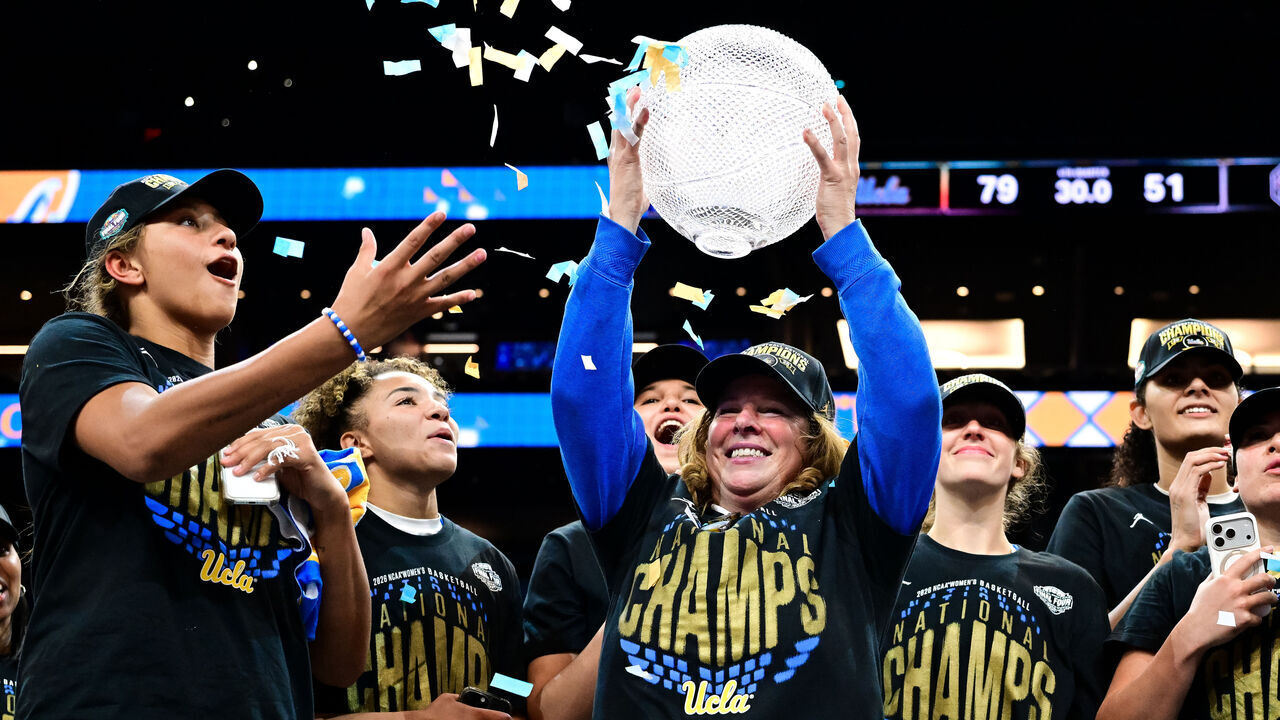 PHOENIX, ARIZONA - APRIL 5: Head coach Cori Close of the UCLA Bruins holds up the WBCA Coaches Trophy after defeating the South Carolina Gamecocks in the NCAA Women's Basketball Championship game at Mortgage Matchup Center on April 5, 2026 in Phoenix, Arizona.