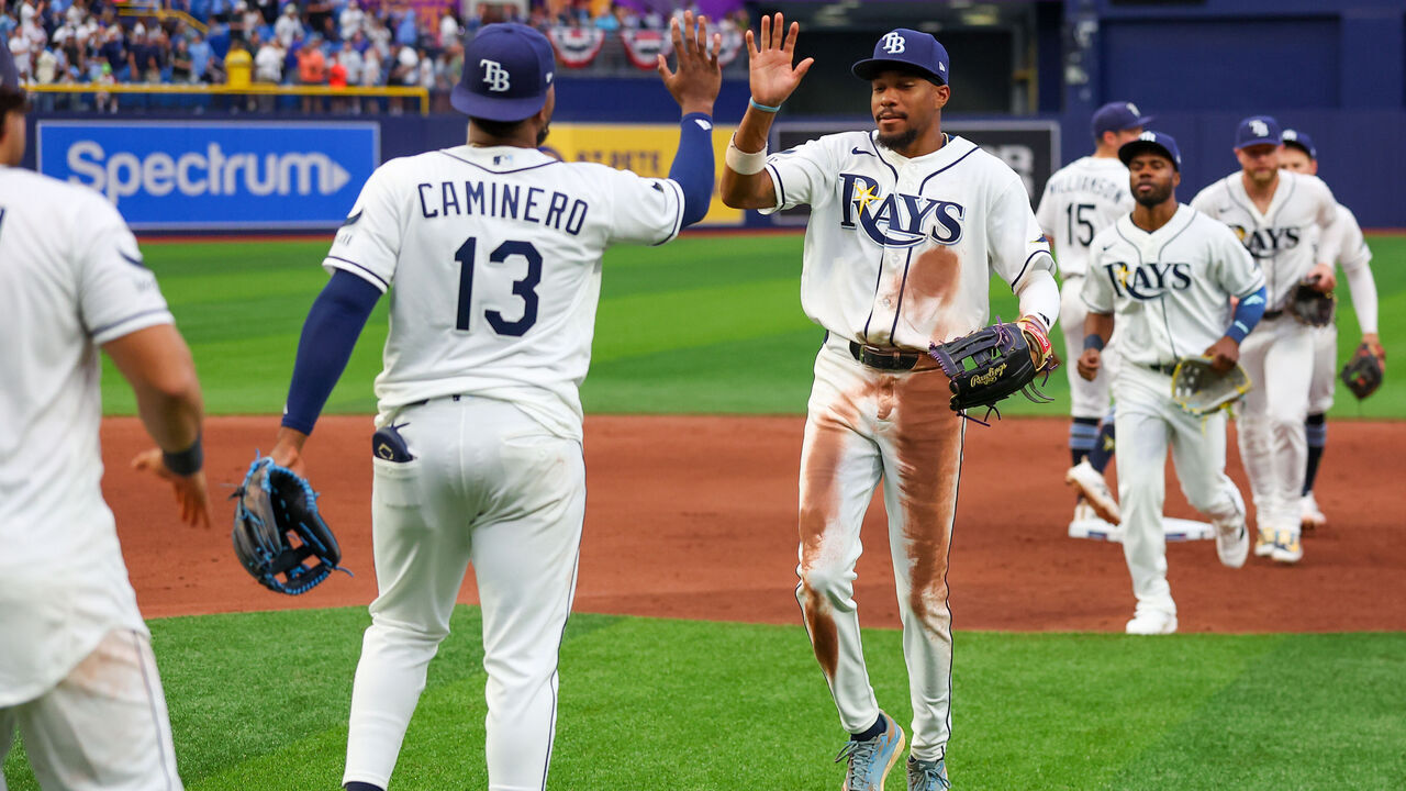 ST. PETERSBURG, FL - APRIL 06: Junior Caminero #13 and Chandler Simpson #14 of the Tampa Bay Rays celebrate after defeating the Chicago Cubs at Tropicana Field on Monday, April 6, 2026 in St. Petersburg, Florida.