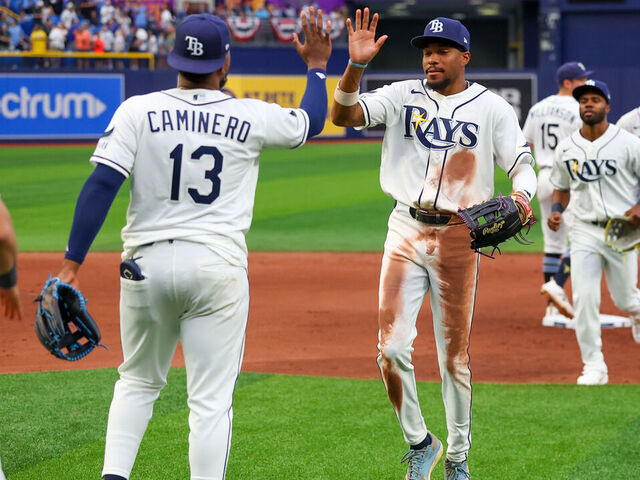 ST. PETERSBURG, FL - APRIL 06: Junior Caminero #13 and Chandler Simpson #14 of the Tampa Bay Rays celebrate after defeating the Chicago Cubs at Tropicana Field on Monday, April 6, 2026 in St. Petersburg, Florida.