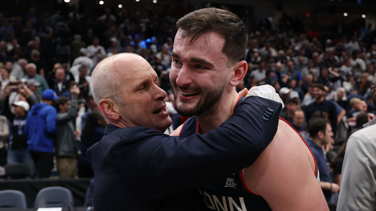 WASHINGTON, DC - MARCH 29: Head coach Dan Hurley of the UConn Huskies celebrates with Alex Karaban #11 after a 73-72 victory against the Duke Blue Devils during the Elite Eight round game of the 2026 NCAA Men's Basketball Tournament held at Capital One Arena on March 29, 2026 in Washington, DC.