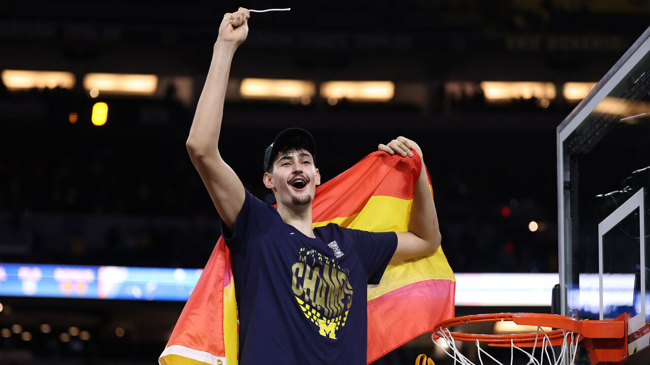 INDIANAPOLIS, INDIANA - APRIL 06: Aday Mara #15 of the Michigan Wolverines cuts down the net after defeating the UConn Huskies 69-63 in the National Championship of the 2026 NCAA Men's Basketball Tournament at Lucas Oil Stadium on April 06, 2026 in Indianapolis, Indiana.