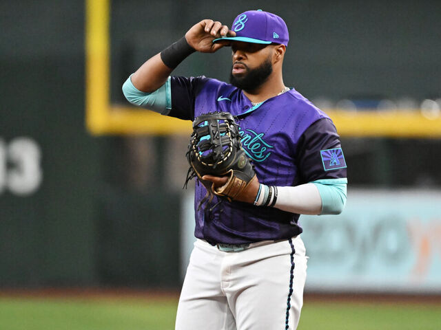 PHOENIX, ARIZONA - APRIL 03: Carlos Santana #41 of the Arizona Diamondbacks gets ready to make a play against the Atlanta Braves at Chase Field on April 03, 2026 in Phoenix, Arizona.