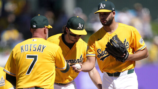 SACRAMENTO, CALIFORNIA - APRIL 04: Manager Mark Kotsay #7 of the Athletics take the ball from pitcher Luis Morales #19 taking Morales out of the game against the Houston Astros in the top of the fourth inning at Sutter Health Park on April 04, 2026 in Sacramento, California.