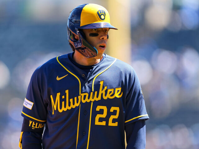 KANSAS CITY, MO - APRIL 05: Christian Yelich #22 of the Milwaukee Brewers celebrates on third base after hitting an RBI triple in the first inning during the game between the Milwaukee Brewers and the Kansas City Royals at Kauffman Stadium on Sunday, April 5, 2026 in Kansas City, Missouri.