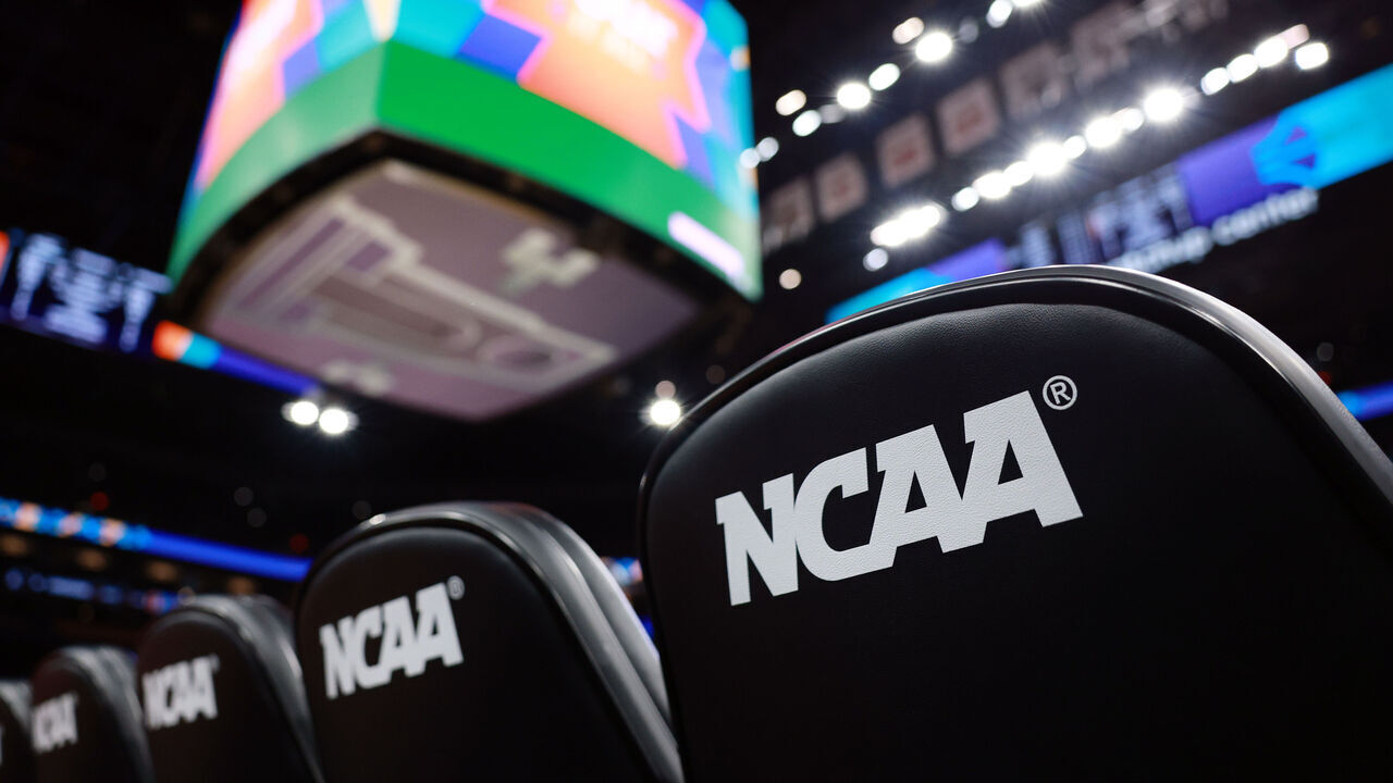 PHOENIX, ARIZONA - APRIL 02: Detail of the NCAA logo on bench seats ahead of the 2026 NCAA Women's Basketball Tournament Final Four at Mortgage Matchup Center on April 02, 2026 in Phoenix, Arizona.
