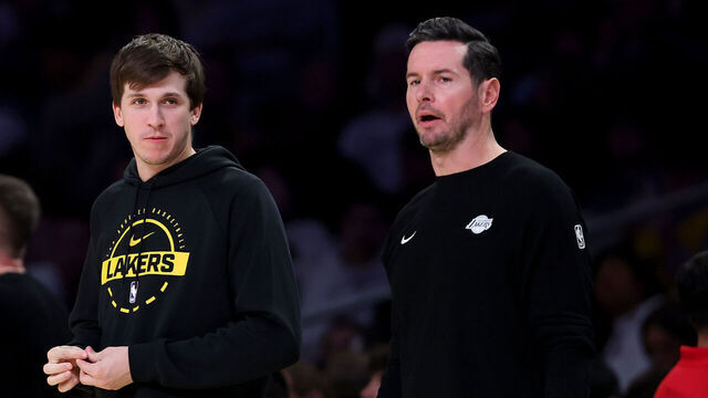 LOS ANGELES, CALIFORNIA - DECEMBER 28: (L-R) Austin Reaves #15 speaks to head coach JJ Redick of the Los Angeles Lakers against the Sacramento Kings during the second quarter at Crypto.com Arena on December 28, 2025 in Los Angeles, California.