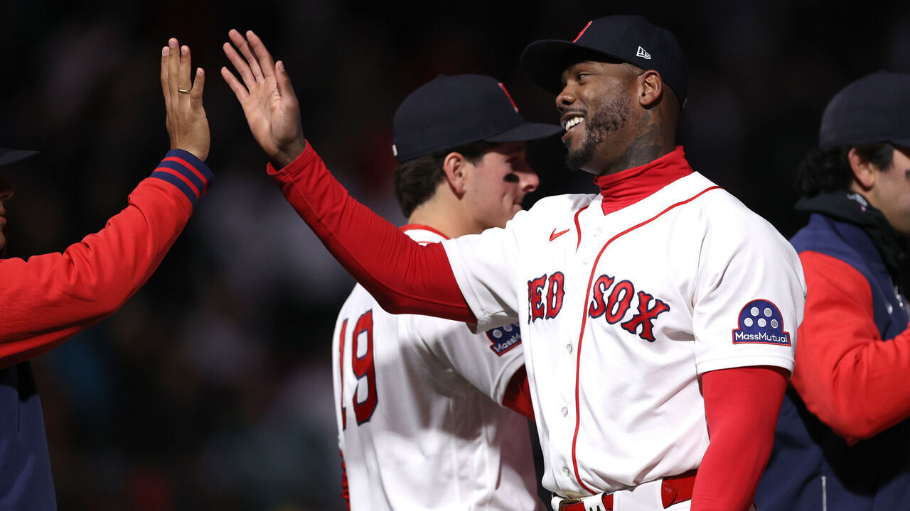 BOSTON, MASSACHUSETTS - APRIL 07: Aroldis Chapman #44 of the Boston Red Sox high fives teammates after defeating the Milwaukee Brewers at Fenway Park on April 07, 2026 in Boston, Massachusetts.