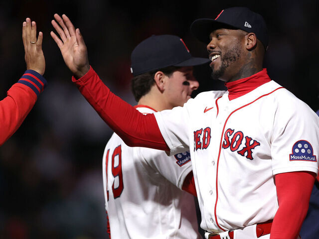 BOSTON, MASSACHUSETTS - APRIL 07: Aroldis Chapman #44 of the Boston Red Sox high fives teammates after defeating the Milwaukee Brewers at Fenway Park on April 07, 2026 in Boston, Massachusetts.