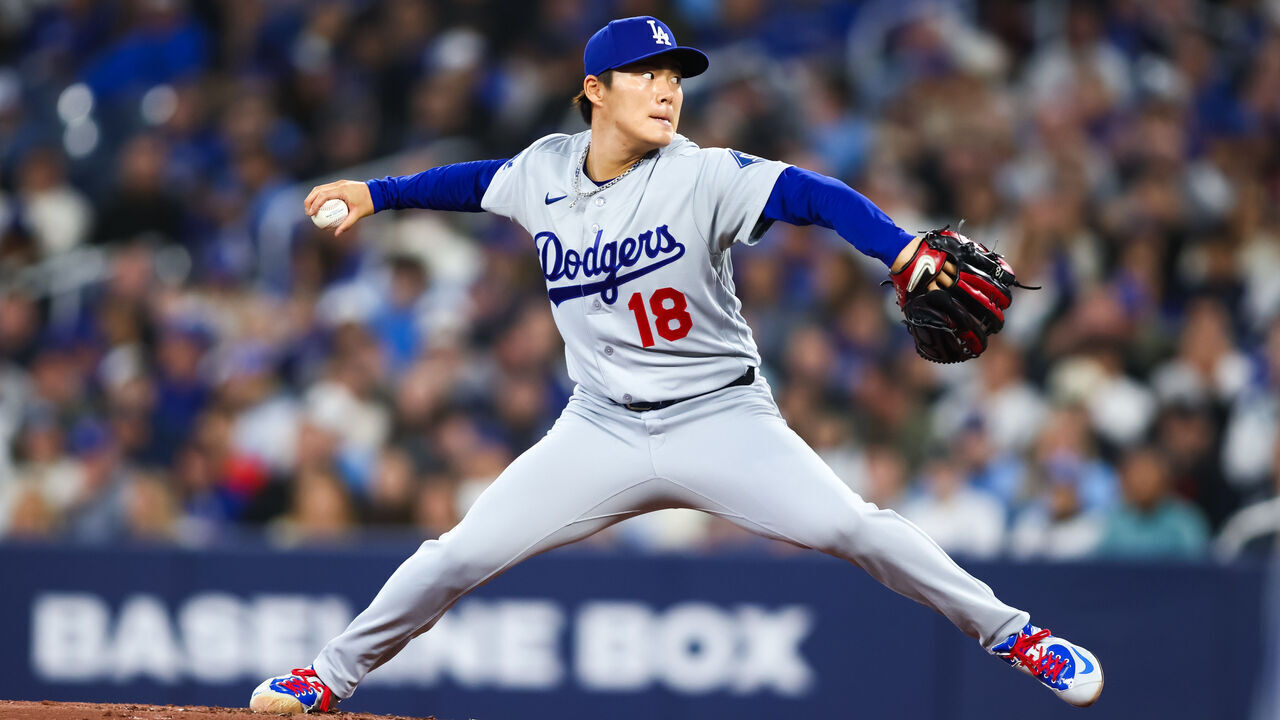 TORONTO, CANADA - APRIL 7: Yoshinobu Yamamoto #18 of the Los Angeles Dodgers pitches in the first inning of their MLB against the Toronto Blue Jays at Rogers Centre on April 7, 2026 in Toronto, Ontario, Canada.