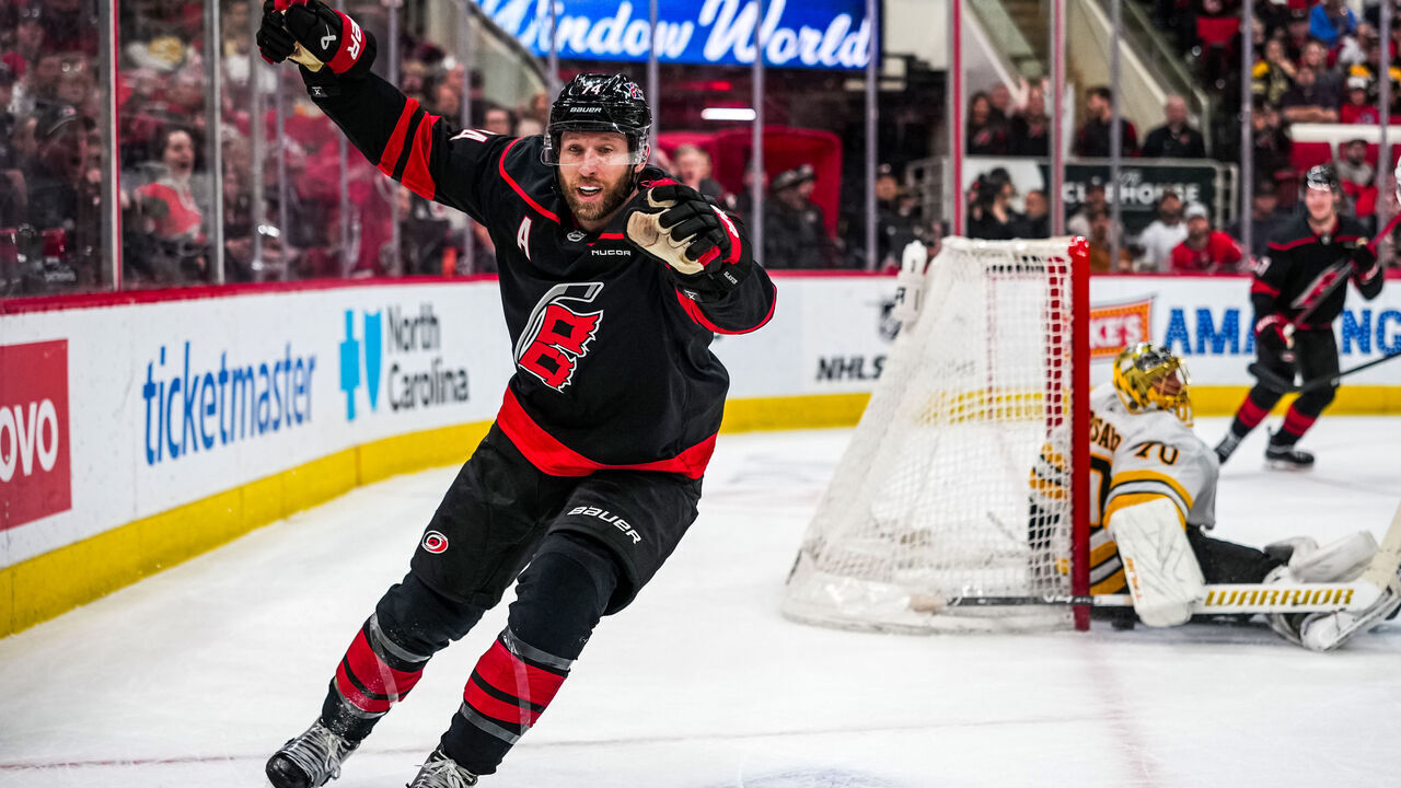 RALEIGH, NORTH CAROLINA - APRIL 07: Jaccob Slavin #74 of the Carolina Hurricanes celebrates after scoring the game-winning goal in overtime to defeat the Boston Bruins at Lenovo Center on April 07, 2026 in Raleigh, North Carolina.