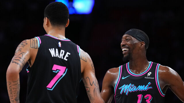 MIAMI, FLORIDA - APRIL 04: Bam Adebayo #13 celebrates a point with Kel'el Ware #7 of the Miami Heat during the second quarter at Kaseya Center on April 04, 2026 in Miami, Florida.