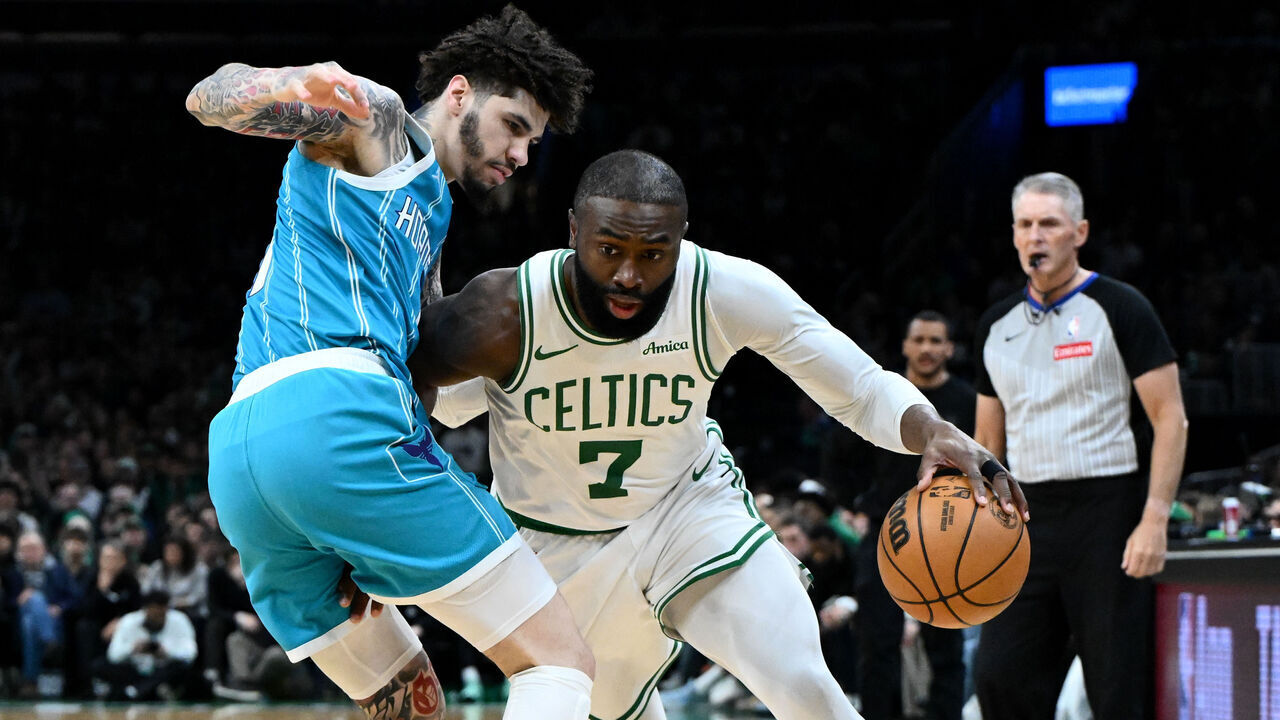 BOSTON, MASSACHUSETTS - APRIL 07: Jaylen Brown #7 of the Boston Celtics drives to the basket against LaMelo Ball #1 of the Charlotte Hornets during the first half at the TD Garden on April 07, 2026 in Boston, Massachusetts.