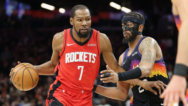 PHOENIX, ARIZONA - APRIL 07: Kevin Durant #7 of the Houston Rockets handles the ball against Jordan Goodwin #23 of the Phoenix Suns during the second half of the NBA game at Mortgage Matchup Center on April 07, 2026 in Phoenix, Arizona.