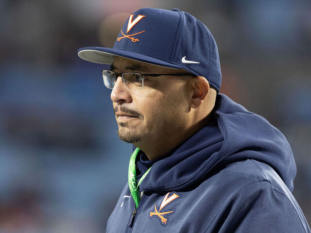 CHARLOTTE, NORTH CAROLINA - DECEMBER 6: Head coach Tony Elliott of the Virginia Cavaliers takes the field before a game against the Duke Blue Devils at Bank of America Stadium on December 6, 2025 in Charlotte, North Carolina.