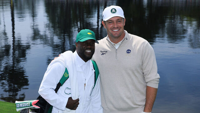 AUGUSTA, GEORGIA - APRIL 8: Bryson DeChambeau of the United States reacts with caddie Kevin Hart during the Par Three Contest prior to the 2026 Masters Tournament at Augusta National Golf Club on April 8, 2026 in Augusta, Georgia.