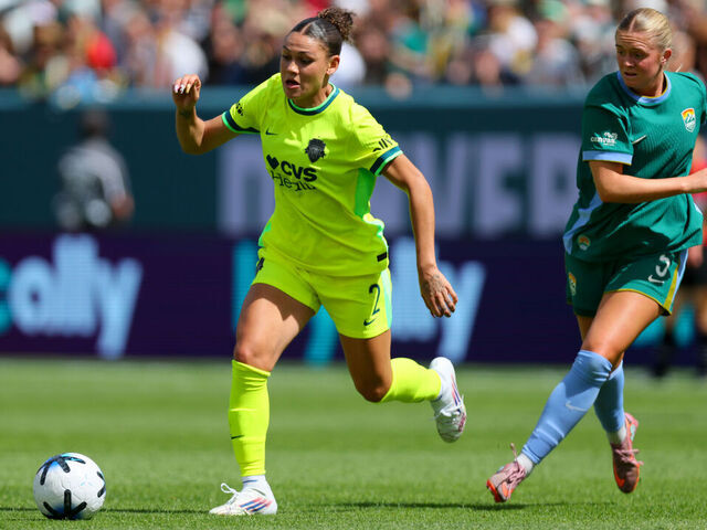 DENVER, CO - MARCH 28: Trinity Rodman #2 of the Washington Spirit controls the ball on her way to goal during the first half against Denver Summit FC at Empower Field at Mile High on March 28, 2026 in Commerce City, Colorado.