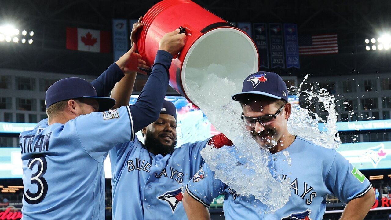 TORONTO, ON - April 8 Toronto Blue Jays left fielder Davis Schneider (36) was the winning run and gets doused by Vladimir Guerrero Jr. (27) and Myles Straw (3) at the end of the game.The Toronto Blue Jays beat the Los Angeles Dodgers 4-3 at the Rogers Centre in MLB baseball actionApril 8 2026 Richard Lautens/Toronto Star (Richard Lautens/Toronto Star via Getty Images)