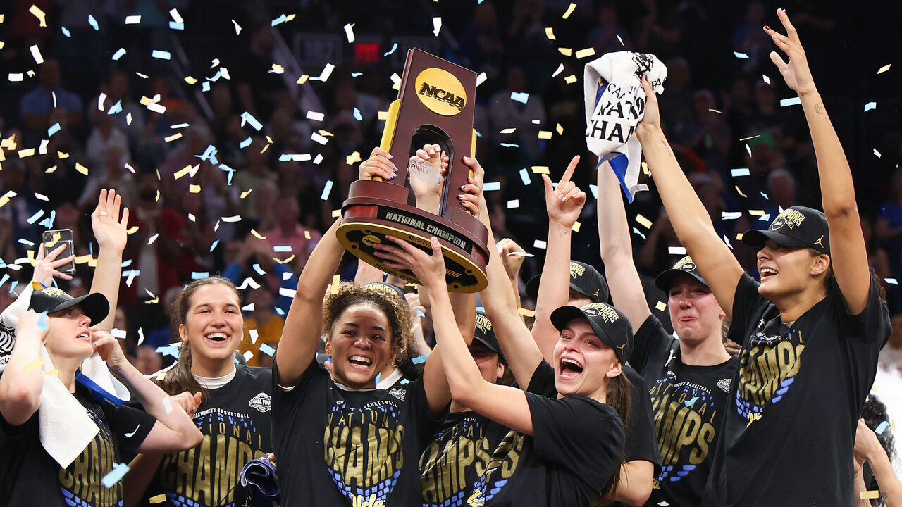 PHOENIX, ARIZONA - APRIL 05: Kiki Rice #1 and Gabriela Jaquez #11 of the UCLA Bruins celebrate with the trophy after the victory against the South Carolina Gamecocks in the National Championship of the NCAA Women's Basketball Tournament at Mortgage Matchup Center on April 05, 2026 in Phoenix, Arizona.