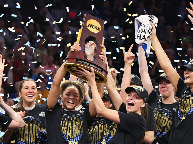 PHOENIX, ARIZONA - APRIL 05: Kiki Rice #1 and Gabriela Jaquez #11 of the UCLA Bruins celebrate with the trophy after the victory against the South Carolina Gamecocks in the National Championship of the NCAA Women's Basketball Tournament at Mortgage Matchup Center on April 05, 2026 in Phoenix, Arizona.