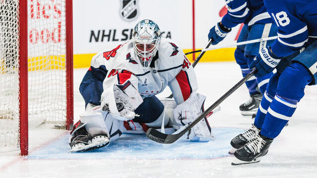 TORONTO, ON - APRIL 08: Washington Capitals goaltender Logan Thompson (48) makes a glove save as Toronto Maple Leafs centers Steven Lorentz (18) and Bo Groulx (29) look on during the second period of an NHL game between the Washington Capitals and the Toronto Maple Leafs on April 08, 2026, at Scotiabank Arena in Toronto, ON.