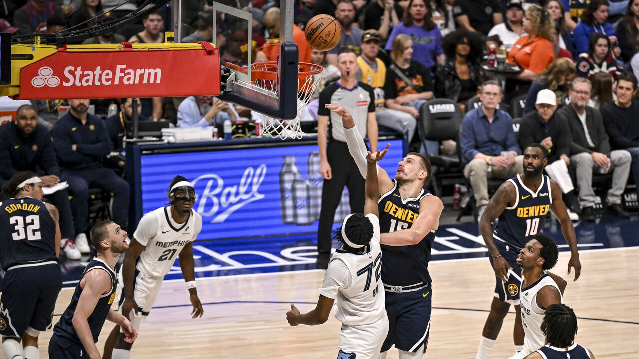DENVER , CO - APRIL 8: Nikola Jokic (15) of the Denver Nuggets defends Adama Bal (72) of the Memphis Grizzlies during the third quarter of the Nuggets' 136-119 win at Ball Arena in Denver, Colorado on Wednesday, April 8, 2026.